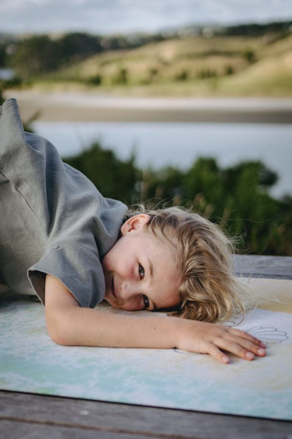 Introduce your kids to yoga with our adorable Mermaid Mat. Petite size, flexi-grip suede finish, and featuring aerial photography of Hawaii.