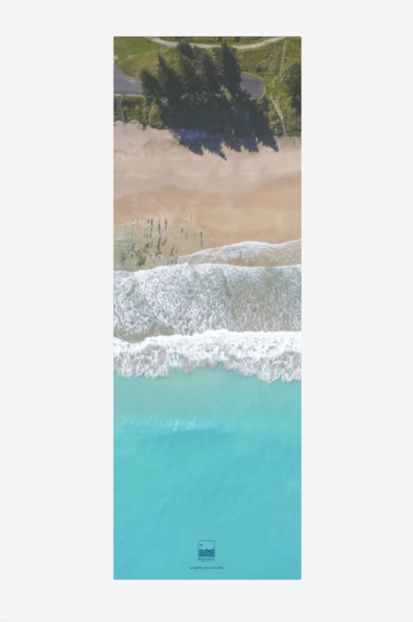 Transport yourself to Gisborne’s Wainui Beach with our yoga mat featuring aerial views of the iconic Pines.